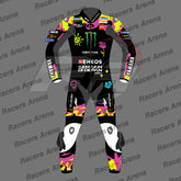 A full-body motorcycle racing suit shown front-facing on a gray background with repeated 'Racers Arena' watermark text. The suit is predominantly black with bright neon pink, yellow, and white graphics and sponsor logos including Monster Energy, Yamaha, ENEOS, and Semakin Didepan.