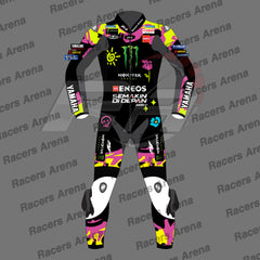 A full-body motorcycle racing suit shown front-facing on a gray background with repeated 'Racers Arena' watermark text. The suit is predominantly black with bright neon pink, yellow, and white graphics and sponsor logos including Monster Energy, Yamaha, ENEOS, and Semakin Didepan.